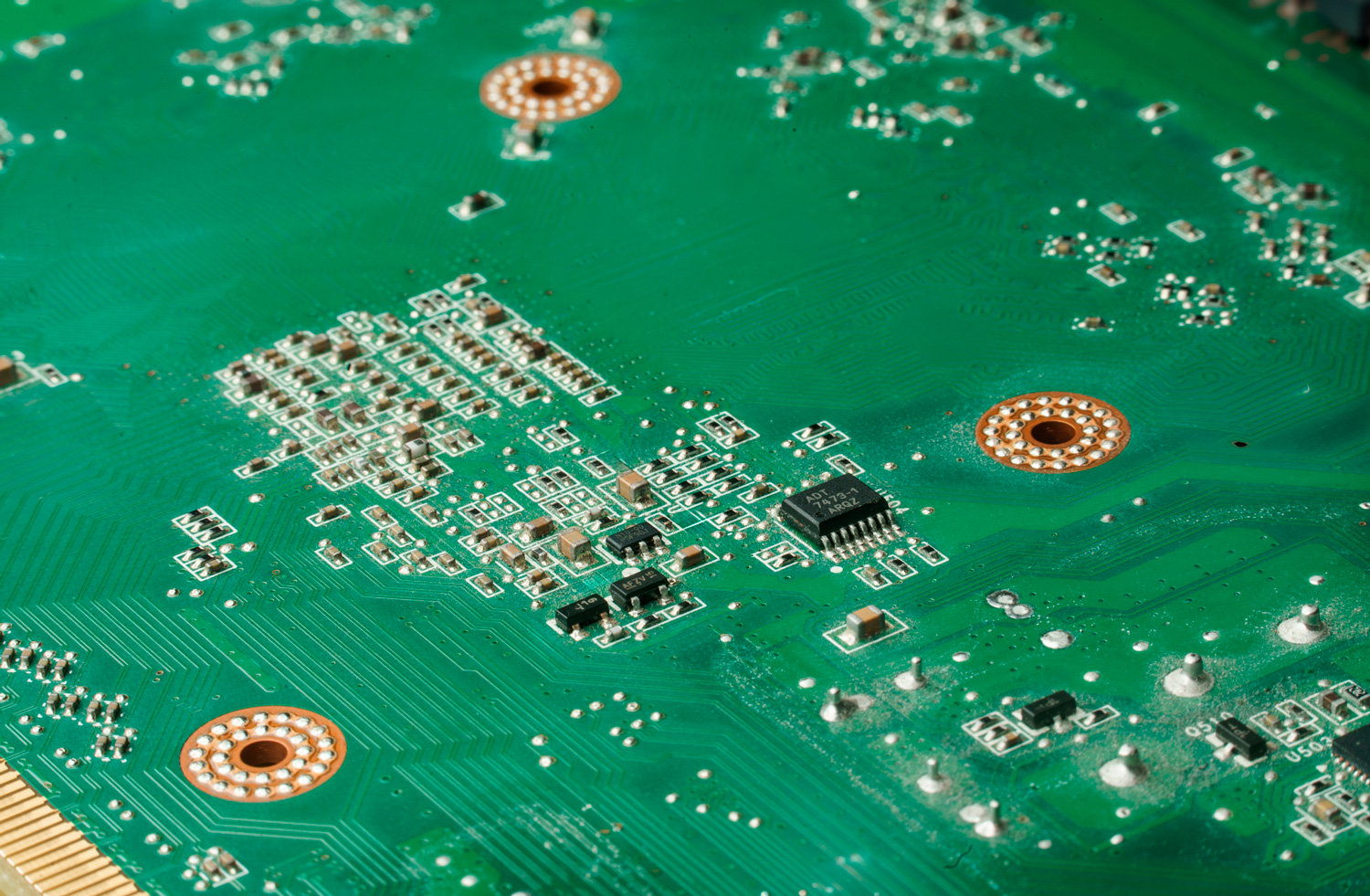 Macro photograph of a green computer circuit board