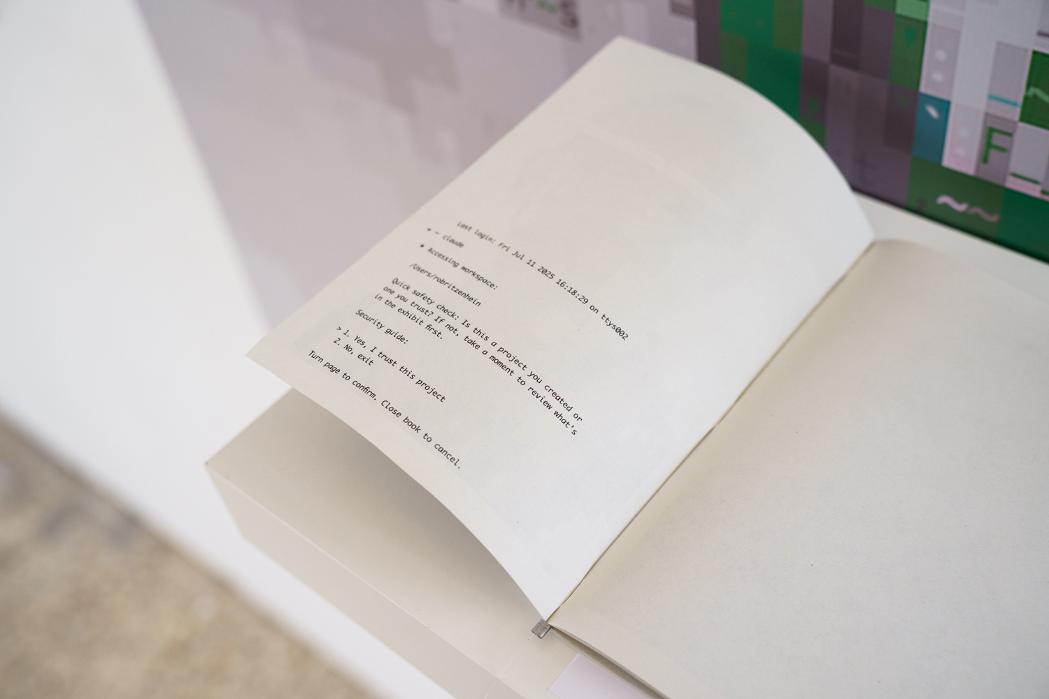 Close-up of an open booklet page styled as a computer terminal transcript with a security prompt asking whether to trust the project